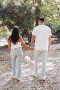 cute dog Cute couple walking and holding hands with dog